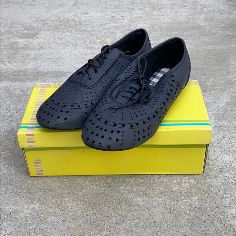 Lace up laser cut out shoes
